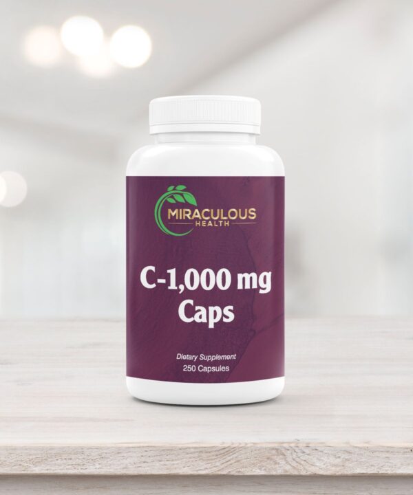 Miraculous Health C-1,000 mg Caps supplement bottle on a wooden surface, containing 250 capsules of high-dose vitamin C to support immune function. This premium product is part of the superior quality supplements offered by Miraculous Health. Miraculous Health offers the finest vitamins and supplements to fuel your health and wellness journey. Visit MiraculousHealth.org to learn more!