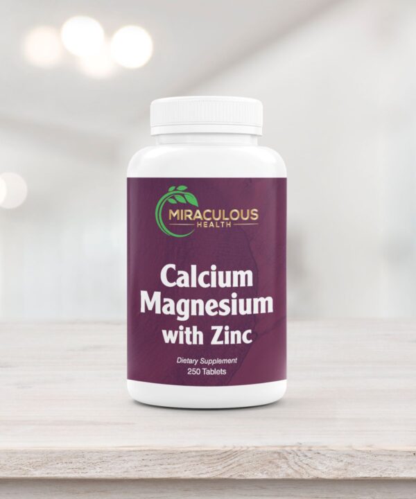 Miraculous Health Calcium Magnesium with Zinc dietary supplement bottle placed on a clean wooden surface, supporting bone and immune health. The label indicates it contains 250 tablets. This product reinforces the brand's commitment to high-quality supplements. Miraculous Health offers the finest vitamins and supplements to fuel your health and wellness journey. Visit MiraculousHealth.org to learn more!