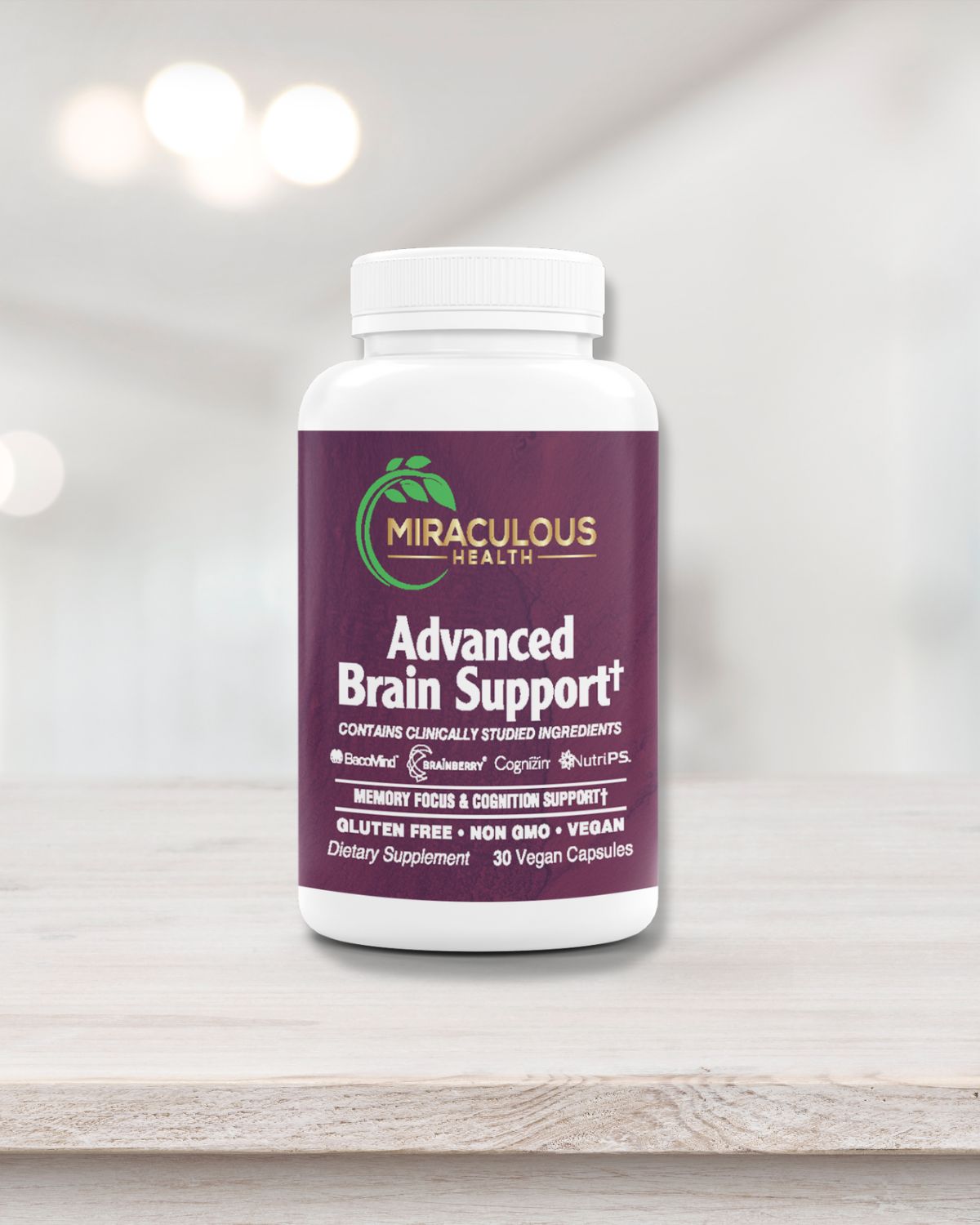 Miraculous Health Advanced Brain Support supplement bottle positioned on a light wooden surface with a clean background. The label highlights clinically studied ingredients such as BacopaMind, Brainberry, Cognizin, and NutriPS, designed to support memory, focus, and cognitive function. The product is gluten-free, non-GMO, and vegan, containing 30 vegan capsules. Miraculous Health offers the finest vitamins and supplements to fuel your health and wellness journey. Visit MiraculousHealth.org to learn more!